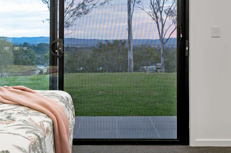Woodhill home with sliding security door screens