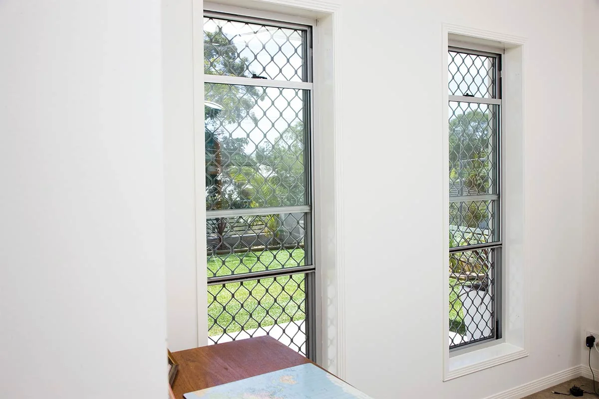 Welded Diamond grille security window screen on double hung windows